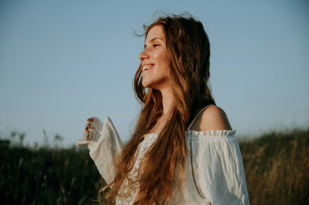 A woman smiles after med management in Florida